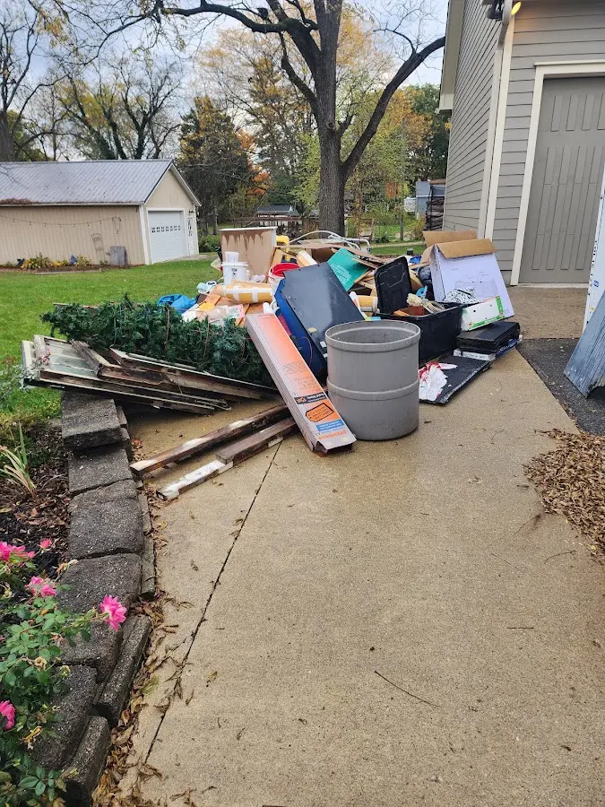 Dumpster being loaded with debris for Residential Dumpster Rental in Broadview